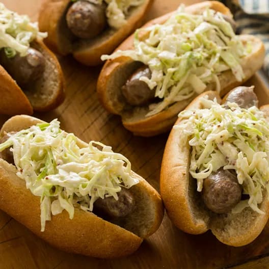 Creamy Whole Grain Mustard Slaw Topped Bratwursts